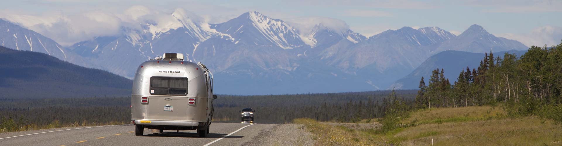 Alaska Highway with scenic Mountain Vista in backdrop